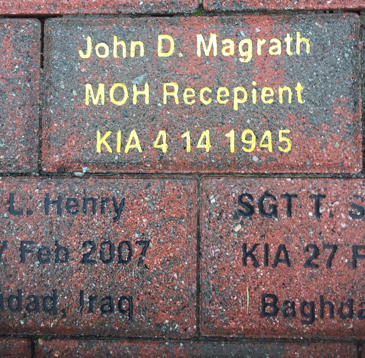 A section of the 10th Mountain Division memorial brick walkway showing inscribed granite bricks.